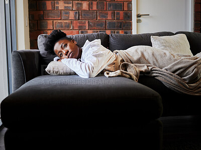 Buy stock photo Sad, depression and stress girl thinking on the couch in the living room. Black woman suffering from mental health, anxiety and depressed after relationship, personal  problem or life crisis in home 