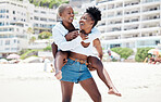 Lesbian, gay and lgbt with a woman couple having fun with a smile together on the beach during summer. Dating, romance and love with a homosexual female and her partner on holiday or vacation