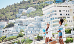 Vacation, holiday and beach with a young woman and her friend outside on the coast during summer. Travel, friends and tourism with beautiful females having a picnic while traveling overseas or abroad