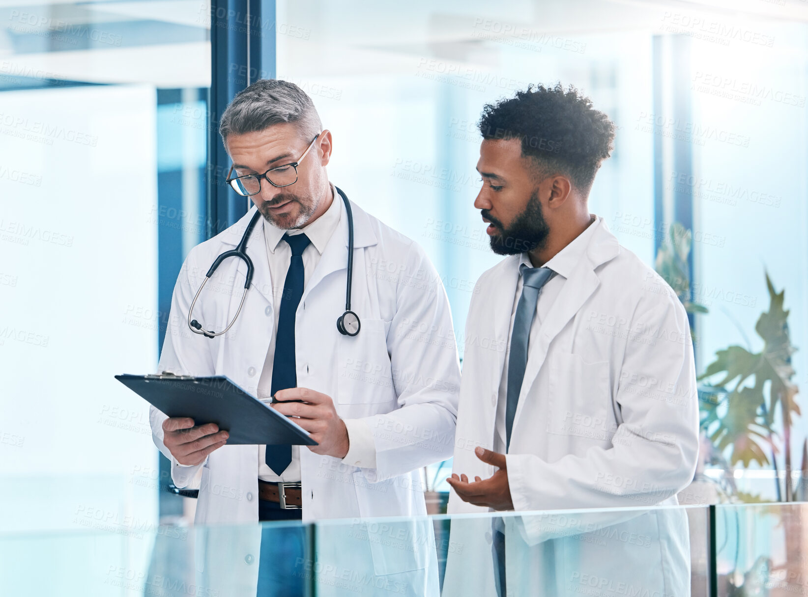 Buy stock photo Doctor , healthcare worker and medical expert talking about health insurance, collaboration in surgery and communication about results at a clinic. Expert employees working on research in hospital