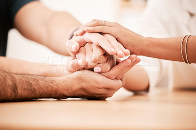 Buy stock photo Support, care and family holding hands together at table to show empathy, love and hope. Closeup of connection, trust and friendship in community rehab group showing compassion and gratitude.
