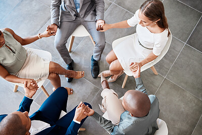 Buy stock photo Diversity, support and collaboration of business people holding hands above in trust for company success. Diverse group of corporate workers in a circle of unity for a meeting together at the office