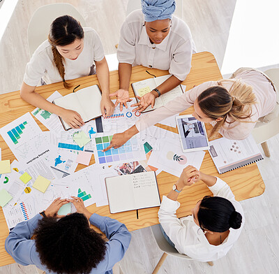 Buy stock photo Women marketing or advertising team planning a work strategy at a table in a startup company. Diversity, collaboration and teamwork in a office, support creative idea or growth with staff in business