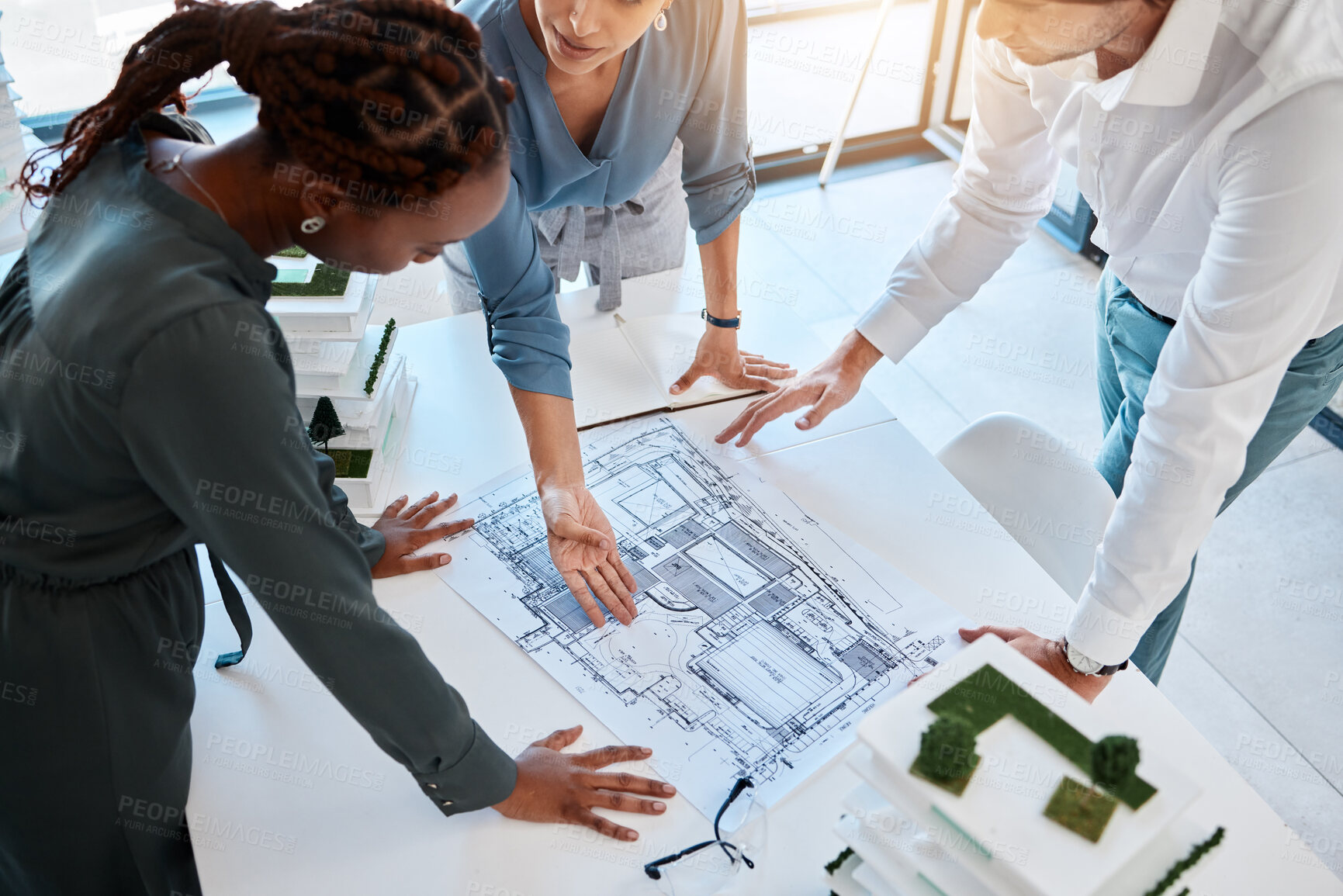 Buy stock photo Building blueprint, architecture and engineering team planning a real estate development project. Teamwork, collaboration and diversity of engineer group working together on interior house logistics