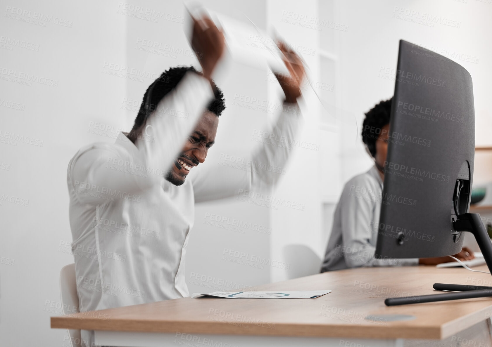 Buy stock photo Stress, angry and frustrated African businessman working on a computer in a modern company office. Aggressive, corporate and black employee upset about broken desktop while doing an online project.