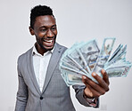 Happy black man with dollars, money or winner isolated on a grey mockup background. Finance, wealth and excited rich African person with a stack of bills, lotto or financial investment business deal
