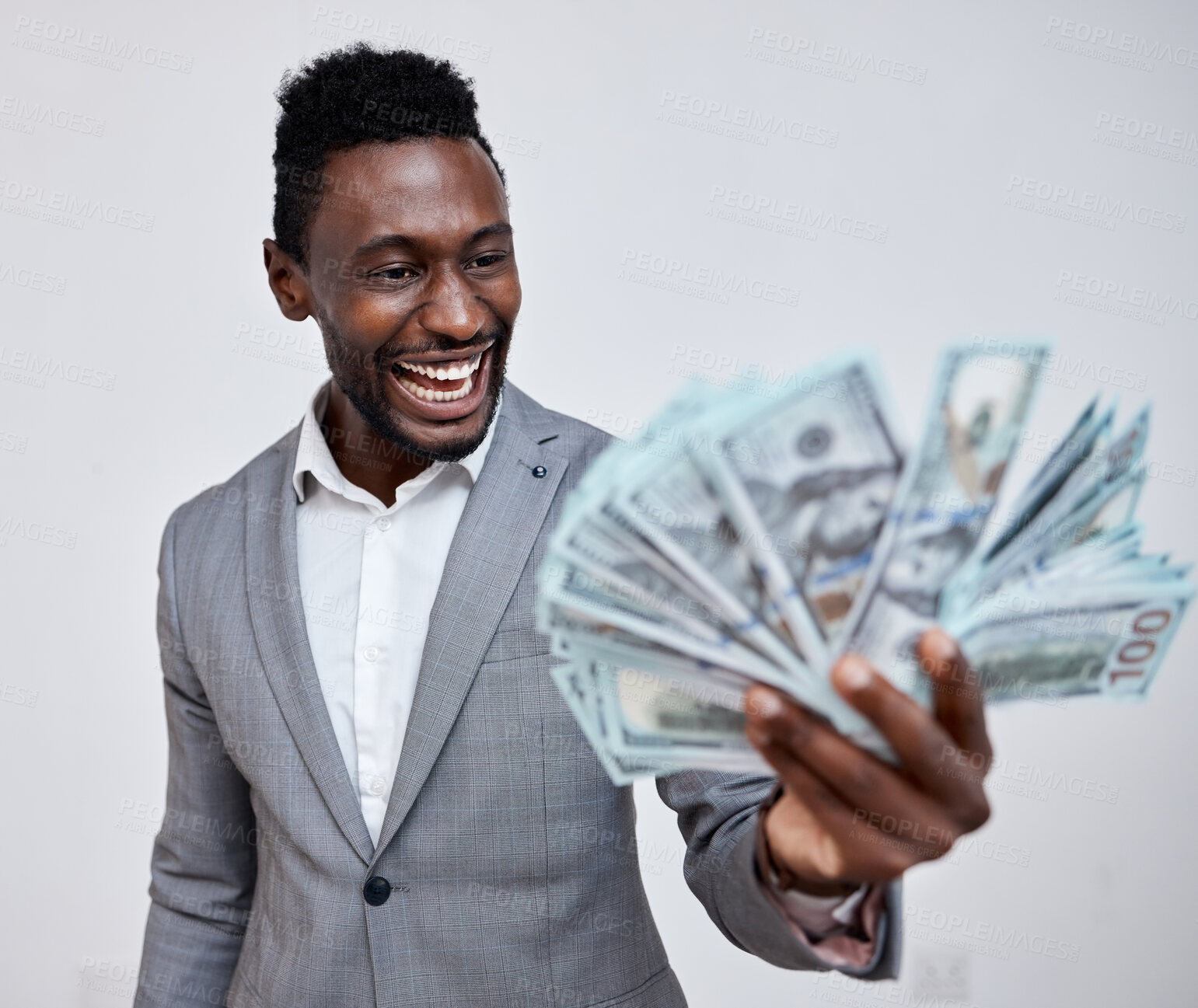 Buy stock photo Happy black man with dollars, money or winner isolated on a grey mockup background. Finance, wealth and excited rich African person with a stack of bills, lotto or financial investment business deal
