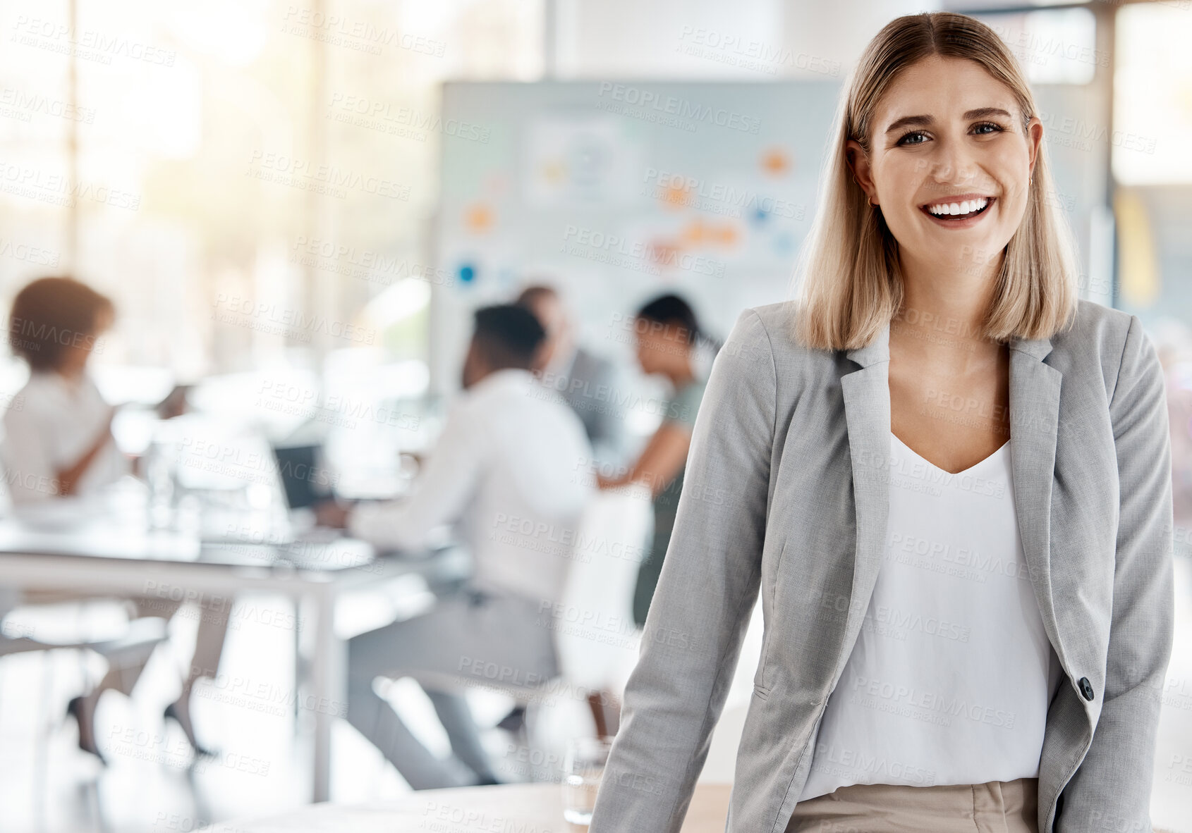 Buy stock photo Portrait of a happy business manager and boss of a creative team of startup advertising designers. Proud, smiling businesswoman or leader feeling confident and happiness while working in the office