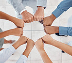 Fist of diversity business team work together in partnership, collaboration and teamwork top view. Hands of business people at support, team building and strategy meeting for corporate global success