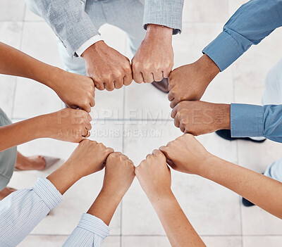 Buy stock photo Fist of diversity business team work together in partnership, collaboration and teamwork top view. Hands of business people at support, team building and strategy meeting for corporate global success