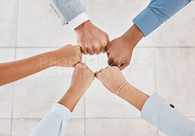 Buy stock photo Diversity, team building and business people with their fist together to show teamwork, motivation and support. World, partnership and hands in a circle to show solidarity, mission and goals top view