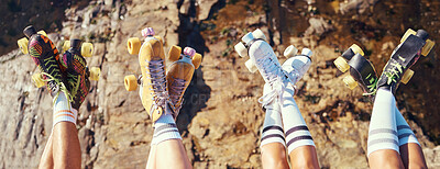 Buy stock photo Roller skates, fun and adventure travel with friends group lifting legs and showing off retro skating footwear while outside. Group of women enjoying hobby, freedom and activity on holiday together