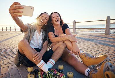 Buy stock photo Selfie of young skater friends with phone smile and laugh at the beach. Cool cheerful man and woman smiling and having fun on the weekend. Happy couple with rollerskate having fun together outside 