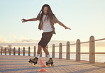 Roller skates, beach and sport with a man riding around training cone for fun, fitness and exercise at the seaside promenade. Hipster male athlete skating outside for leisure, health and recreation