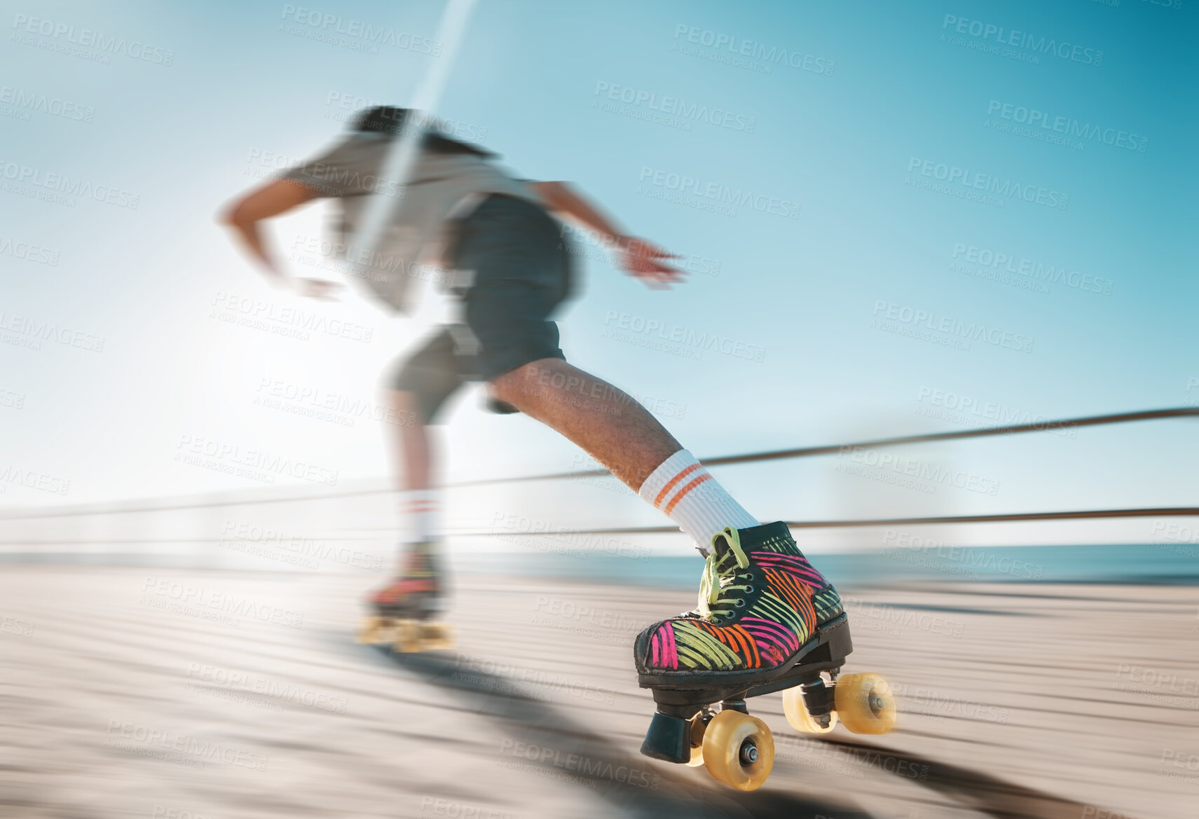 Buy stock photo Freedom, speed and fitness, a woman on roller skates in the sun. Summer sports, retro exercise and a girl skating as a workout. Action, motion and sunshine, a professional skater going fast on a path
