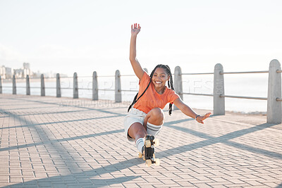 Buy stock photo Fashion black woman, roller skating or fun by beach, sea or ocean brick street in Miami, Florida. Portrait of smile, happy or playful student with trend, style or cool clothes in freedom sports stunt