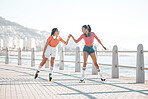 Black women, fist bump and roller skating happy friends by the sea, ocean or shore outdoors. Support, partnership and girl team collaboration or fun while traveling down promenade together.


