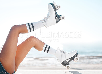 Buy stock photo Roller skates, travel and summer vacation and beach fun with woman enjoying hobby, relax and freedom while skating. Legs and retro footwear of a fit female skater out for active adventure by the sea