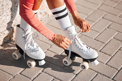 Buy stock photo Roller skate shoes, woman tying laces and fun summer fitness activity, holiday workout and urban lifestyle outdoor. Gen z, girl and youth ready to start skating, travel and healthy wellness exercise