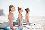 Team yoga on beach, relax meditation in nature and zen during pilates class at the sea, collaboration training for wellness at sea and spiritual workout in summer. Women doing sports ocean exercise