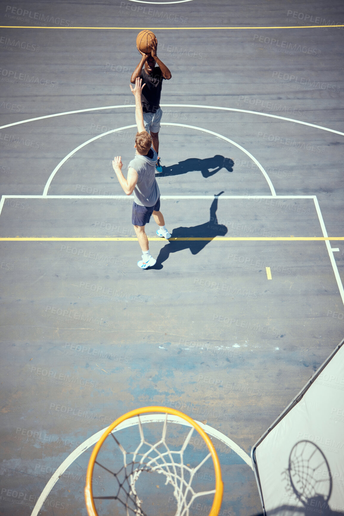 Buy stock photo Basketball court players point score, team sports playing game and shooting in net with aim to win competition, match and action as community friends. Fitness skills, above  and training outdoors