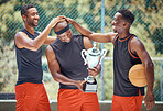Basketball game, team sports and trophy winner in sport competition on court, collaboration for winning and teamwork for success in event. African athlete celebrate prize and champion achievement