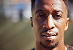 Sport, basketball and face with a man workout portrait for health, workout and fitness. Motivation, vision and mindset with a black male athlete, trainer or coach on a court outside