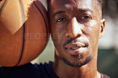 Buy stock photo Basketball, sport and face with a man training with a ball for health, workout and fitness. Motivation, sports and exercise with a young male athlete playing a game or match on a court outside