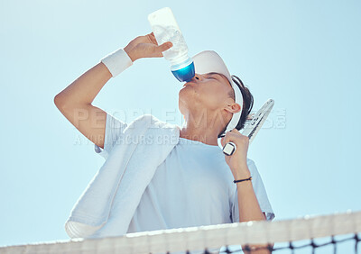 Buy stock photo Sport, fitness and tennis man drinking water after workout, training game or health exercise on court. Wellness, sports and drink liquid from bottle after cardio, run or exercising  
