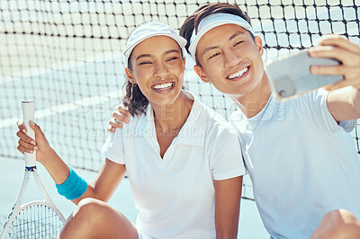 Buy stock photo Fitness, phone and couple in a selfie on a tennis court in summer before training, exercise and workout together. Happy, smile and young woman with healthy Asian boyfriend posing for social media