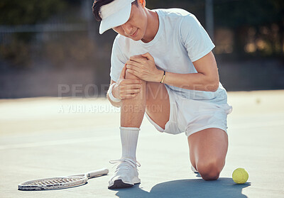 Buy stock photo Sport, pain and tennis injury by athlete man holding knee during a competitive match at outdoor court. Professional asian tennis player suffering from hurt muscle, fitness accident while exercising