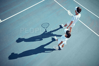 Buy stock photo Sport, fitness and tennis player team discussion of game strategy while walking together on a tennis court from above. Professional, athletic and competitive man and woman planning and training