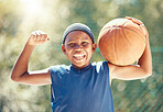 Child, basketball and fun with strong black boy holding a ball and ready to play outside for fitness hobby, health and wellness. Flexing muscles, happy childhood and practice with child playing sport