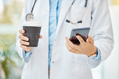 Buy stock photo Female doctor, phone and coffee break with medical healthcare worker reading message, social media notification and online news. Closeup hands of gp using a mobile app with 5g wifi network connection