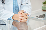 Doctor hands hope or praying sign for bad news in consultation with hospital office desk closeup. Healthcare therapist hand for serious discussion, diagnosis results or trust, advice and insurance