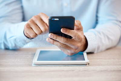 Buy stock photo Internet, technology and communication, a man with phone in hand and tablet on desk. Businessman online in contact with client, reading email or browsing social media. Fintech, ux and payment via app