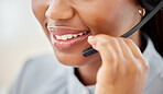 Woman customer service, mouth talking and smile with a headset at a telemarketing or call center office. African American consultant working in help desk or support job while consulting a client