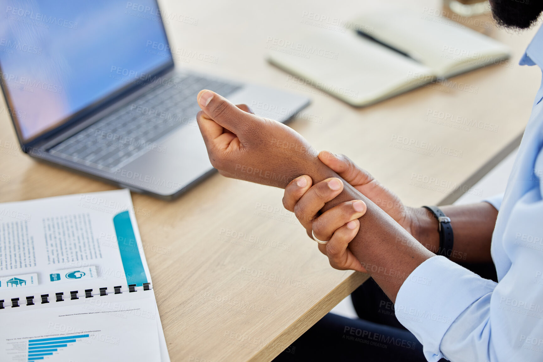 Buy stock photo Wrist pain, business man and muscle injury while sitting at desk and working as a data analyst. Closeup hand of a black male entrepreneur suffering from carpal tunnel syndrome or arthritis in office