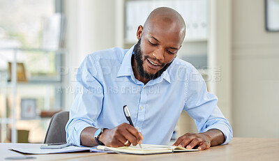 Buy stock photo Businessman writing in a notebook while planning a strategy and working in an office. Happy male professional reading and write market search result and work updating schedule at a corporate company