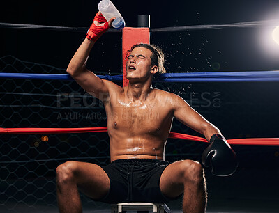 Buy stock photo Boxing athlete with water bottle, tired after workout, training or exercise in a ring. Professional boxer rest and hydrate after fitness mma, muay thai or fighting practice, match and fight