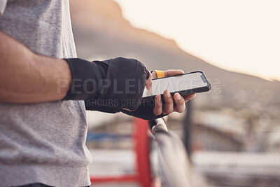 Buy stock photo Gym man, typing and phone screen at boxing fitness training practice for text conversation break. Athlete with a 5g, connection and communication tech at an outdoor sports workout venue.
