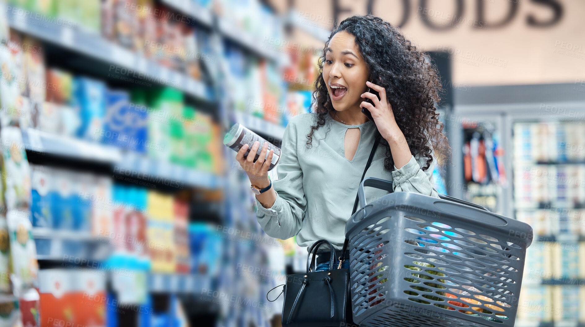 Buy stock photo Supermarket, grocery shopping and surprise of a black woman on a phone call at a retail store. Wow, happy and omg facial expression of a customer hearing deal, price sale on stock and discount food