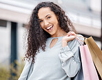 Woman, shopping bags or city retail fashion customer on street or road with Spain building background. Portrait, smile or happy beauty model with store gift present, discount sales clothes or product