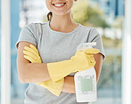 Cleaning service, spray bottle and woman is happy about housekeeping job with detergent products, smile and gloves. Hands, soap liquid and young girl working at home or as a cleaner in an office  