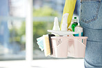 Person with basket of product, in house or room working for cleaning service company. Worker with brush, spray and chemical cleaner in hand, for spring cleaning home, kitchen or office building