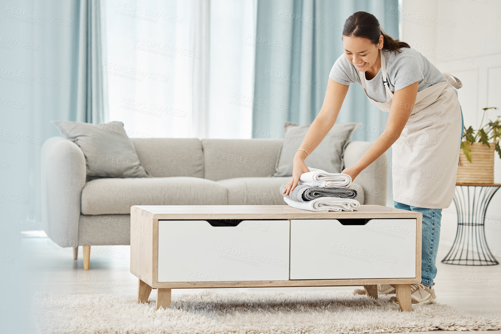 Buy stock photo Asian cleaner or woman with towel laundry happy working for luxury hospitality hotel, home or house cleaning service agency. Japanese girl maid, employee or worker smile and help at rich apartment