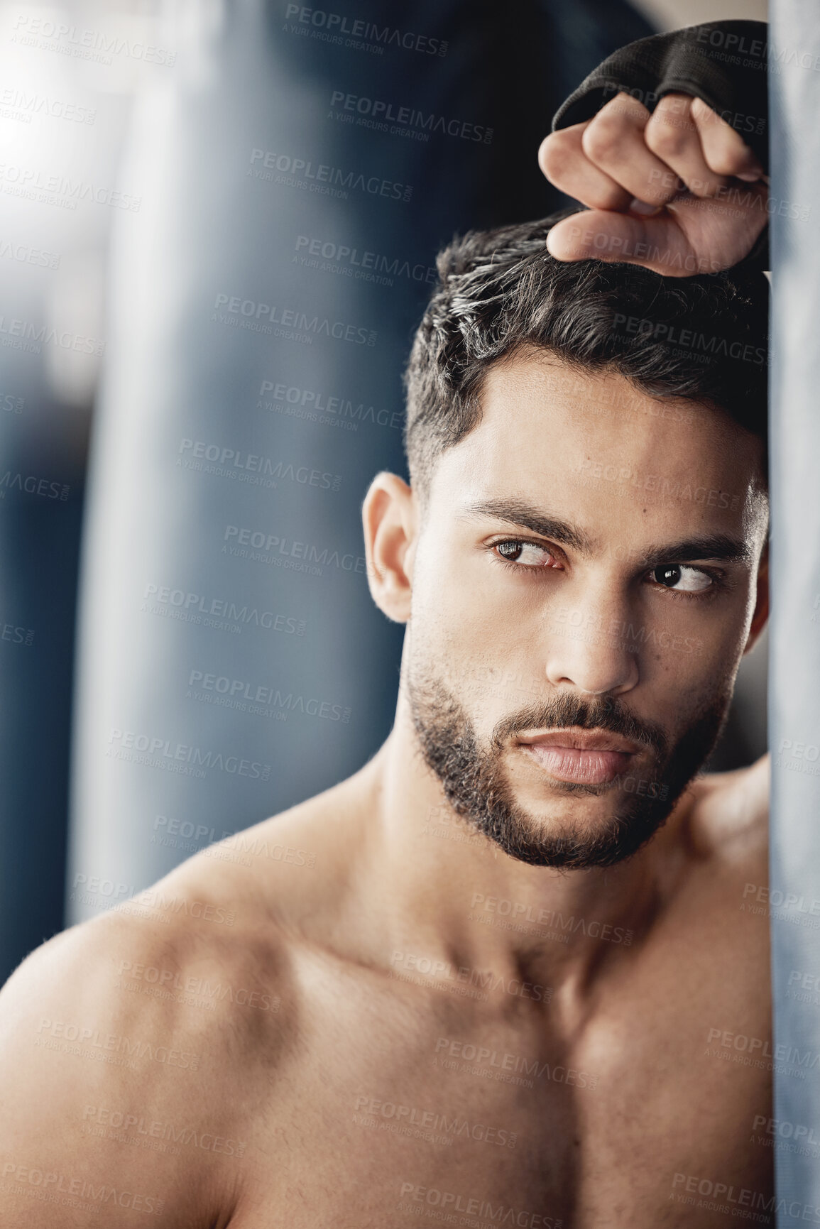 Buy stock photo Fitness, exercise and boxing training by tough man boxer thinking and planning his strategy before a match. Young, athletic and handsome Mexican looking cool and serious, ready for physical challenge