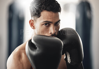 Buy stock photo Fitness portrait of man boxer ready to punch during mma, boxing or fighting workout. Athlete boxing in the gym during training, exercise or practice for a fight, match or competition at a sport club 