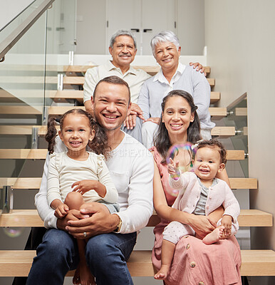 Buy stock photo Big family, three generation and happiness of children, parents and grandparents sitting together on stairs in their home while smiling. Bond, support and closeness of kids with man and woman