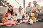 Portrait of a happy family bonding in a living room together, smiling and relaxing on a lounge floor. Cheerful grandparents enjoying the weekend with their grandkid, being playful and having fun 